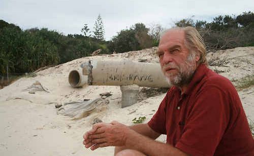 Dr Peter Helman at Broken Head beach, near stormwater pipes which have been eroded by storms and sea level rises. Dr Peter Helman at Broken Head beach, near stormwater pipes which have been eroded by storms and sea level rises.